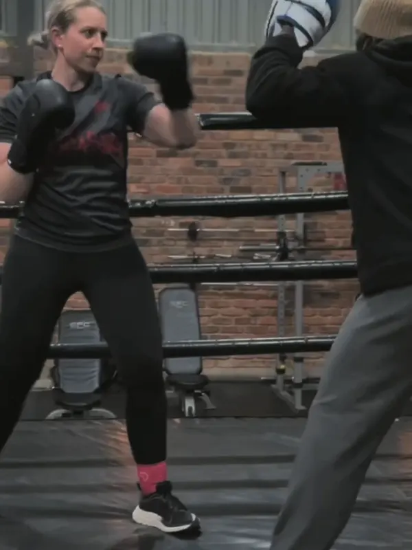 Bootcamp member hitting focus pads with a coach at Urban Warrior Boxing, Sandton
