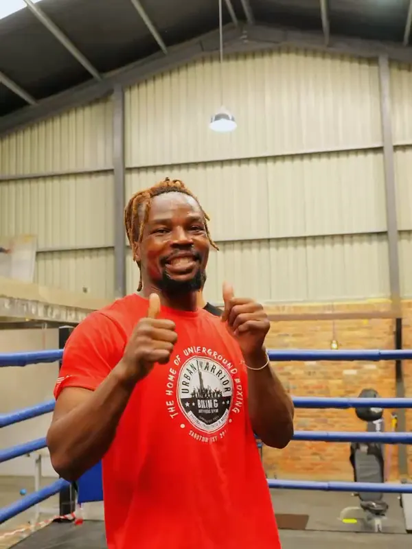 Urban Warrior Boxing coach giving a double thumbs-up in the gym, Sandton